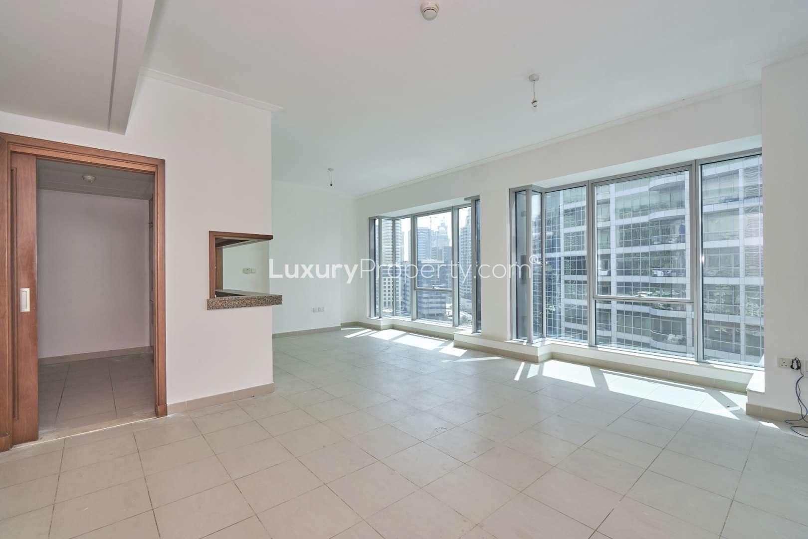 Modern kitchen with wooden cabinets and granite countertops in Dubai Marina apartment for sale