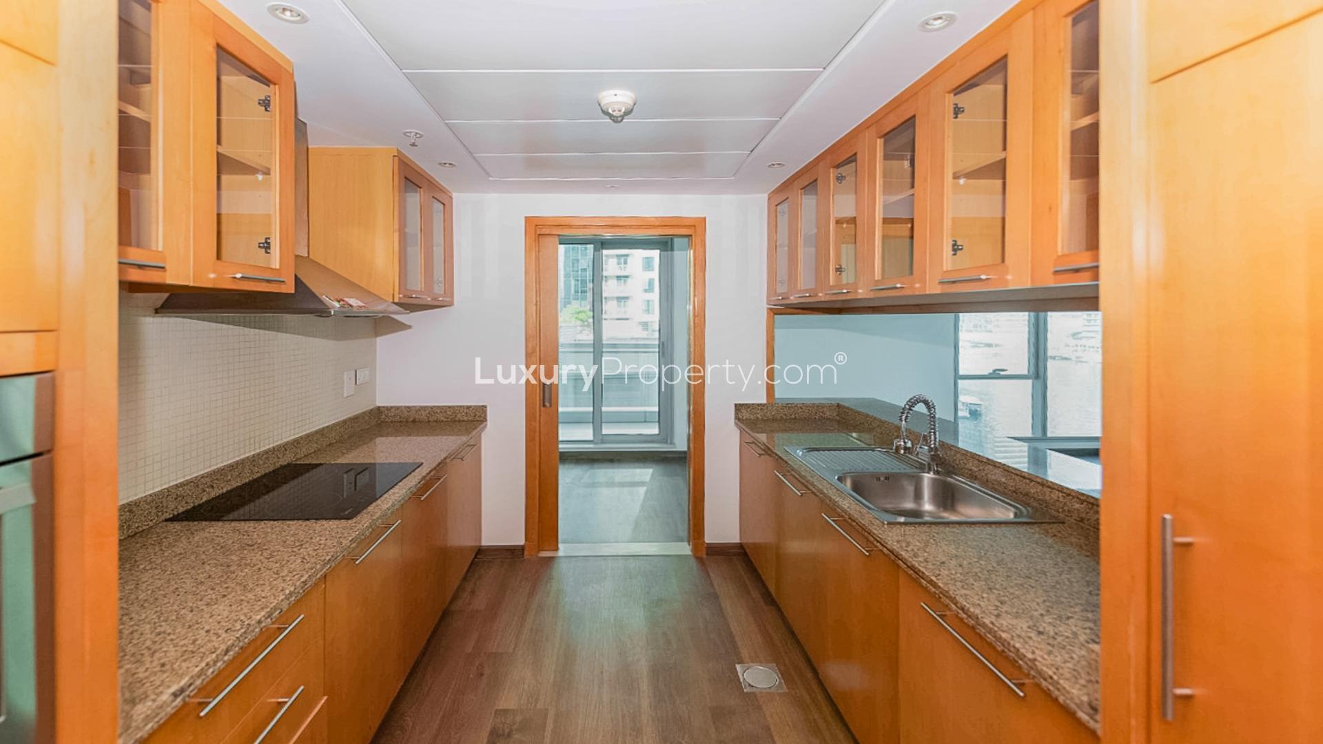 "Spacious living area in upgraded Marina Promenade apartment, Dubai Marina, hardwood floors.","Modern kitchen in upgraded Dubai Marina apartment with sleek cabinetry and granite countertops.",Hallway in upgraded 2-bedroom apartment, Marina Promenade, Dubai Marina. Property for sale. LP11468