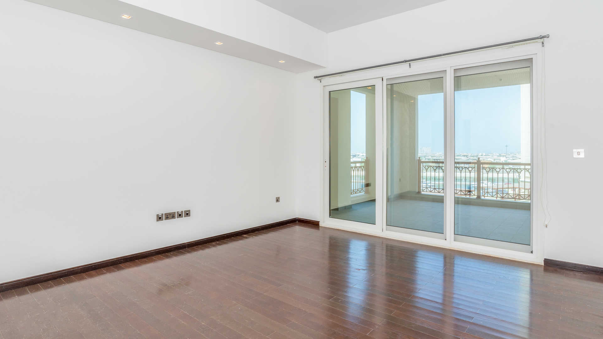 Empty living room with sea view window in Marina Residences apartment, Palm Jumeirah