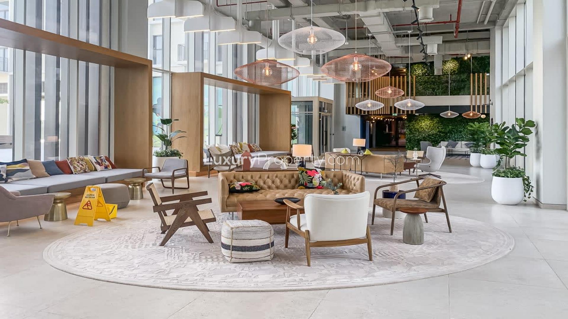 Sunlit living area in 2-bed corner apartment, Dubai Hills Estate, modern interiors, balcony view