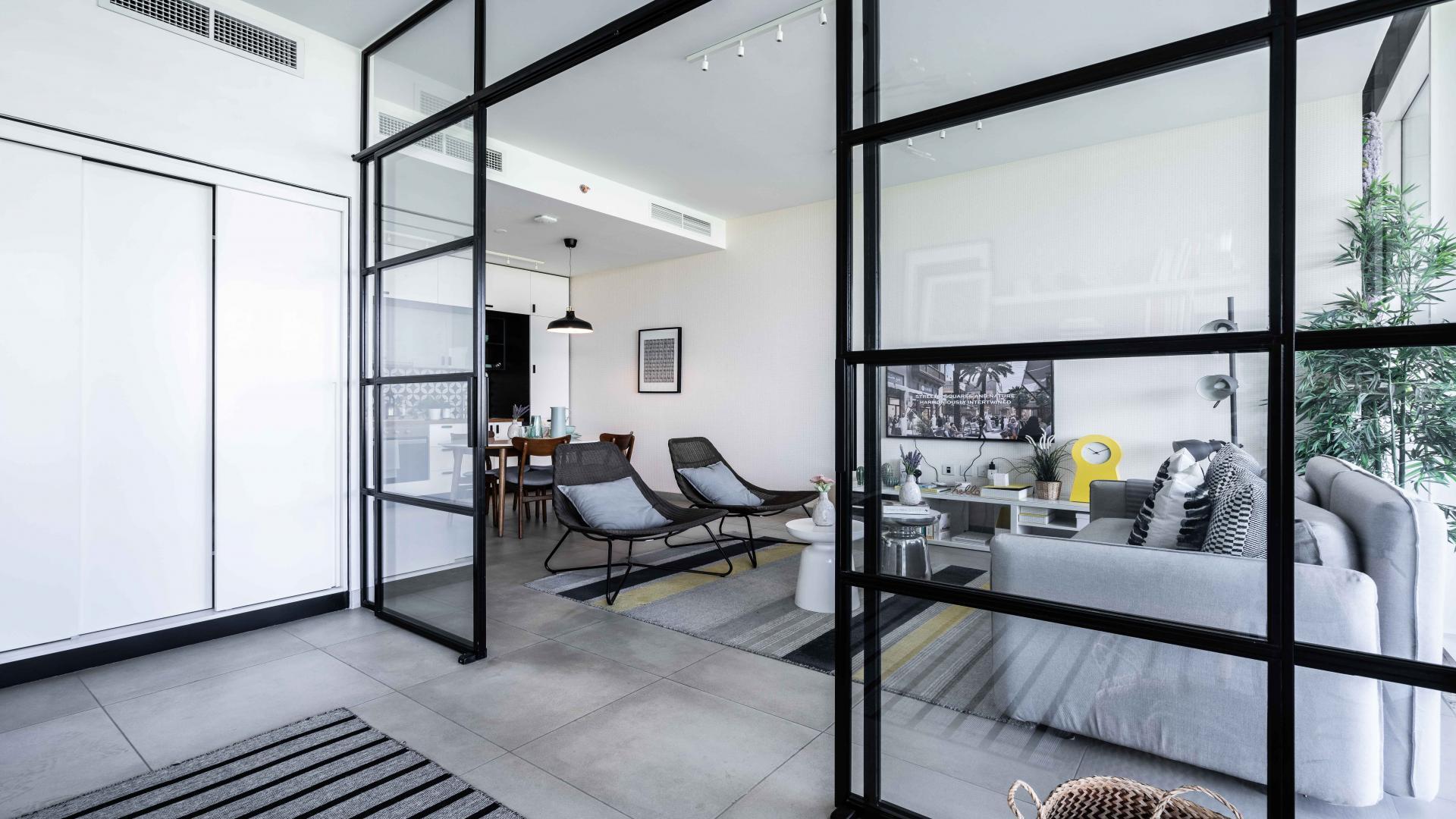 N/A,Modern living room in Dubai Hills Estate apartment, featuring stylish decor and open layout