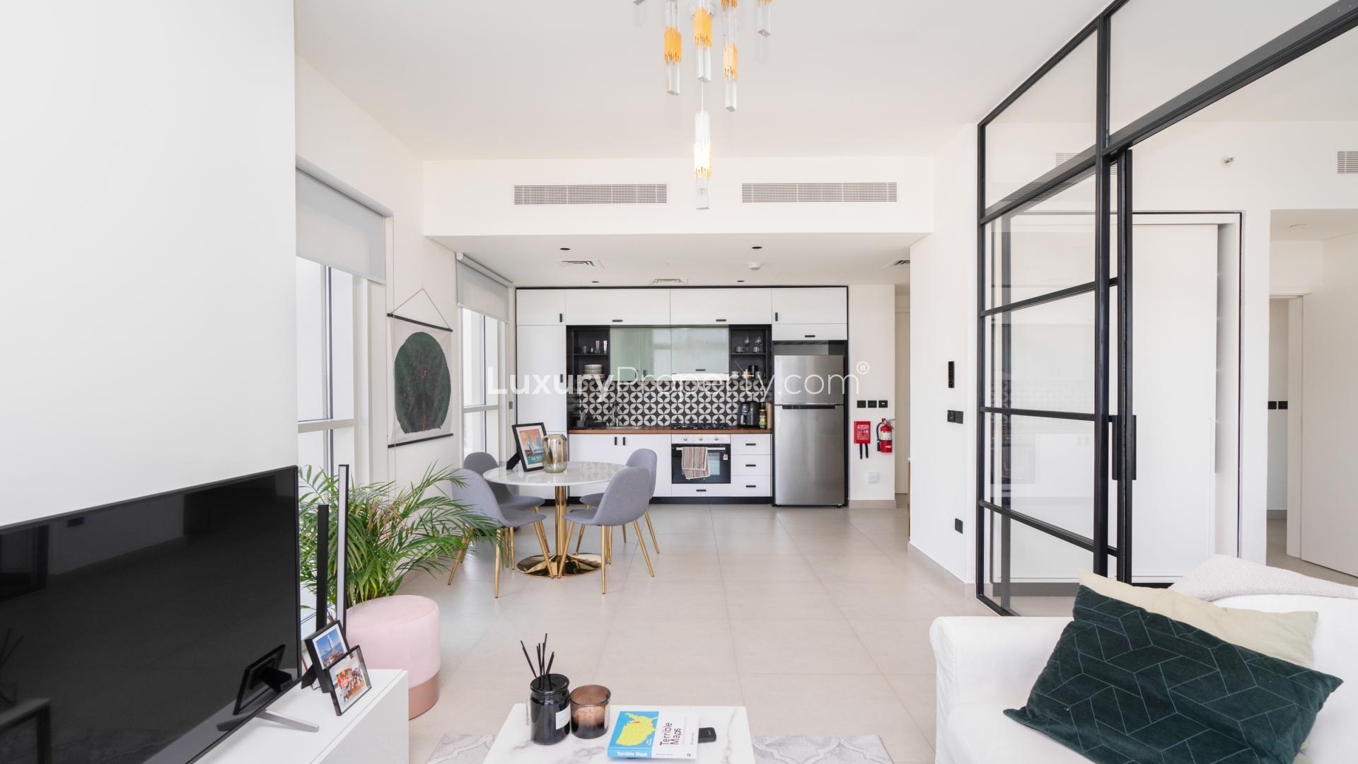 "Balcony view of mall from corner apartment in Dubai Hills Estate, Collective community.",Modern living area in Dubai Hills Estate apartment with stylish kitchen and dining space