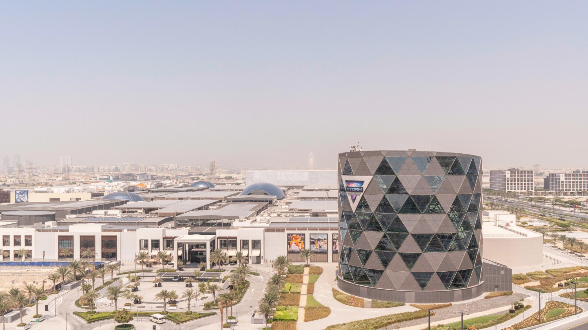 Modern living room in Dubai Hills Estate apartment with balcony and stylish interior design