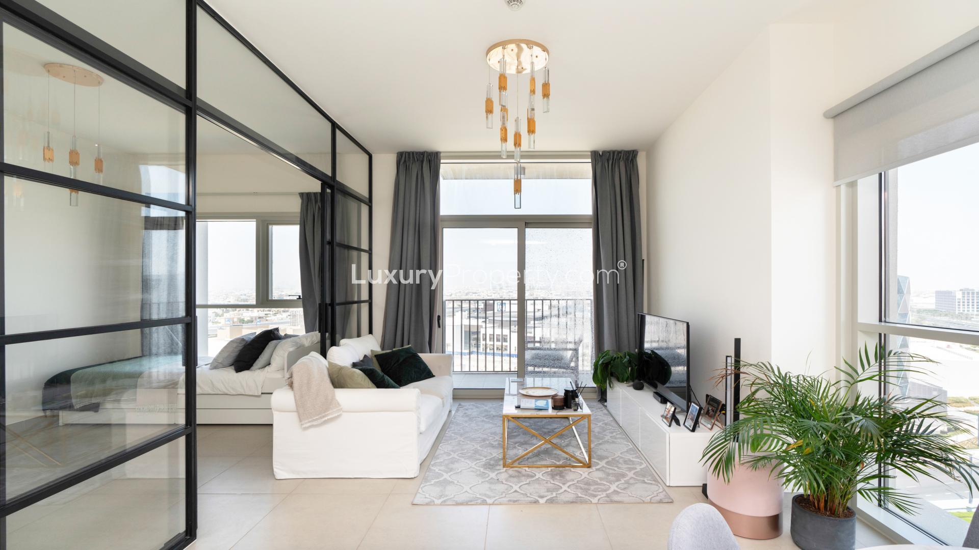 Modern kitchen and dining area in Dubai Hills Estate apartment with stylish decor and views