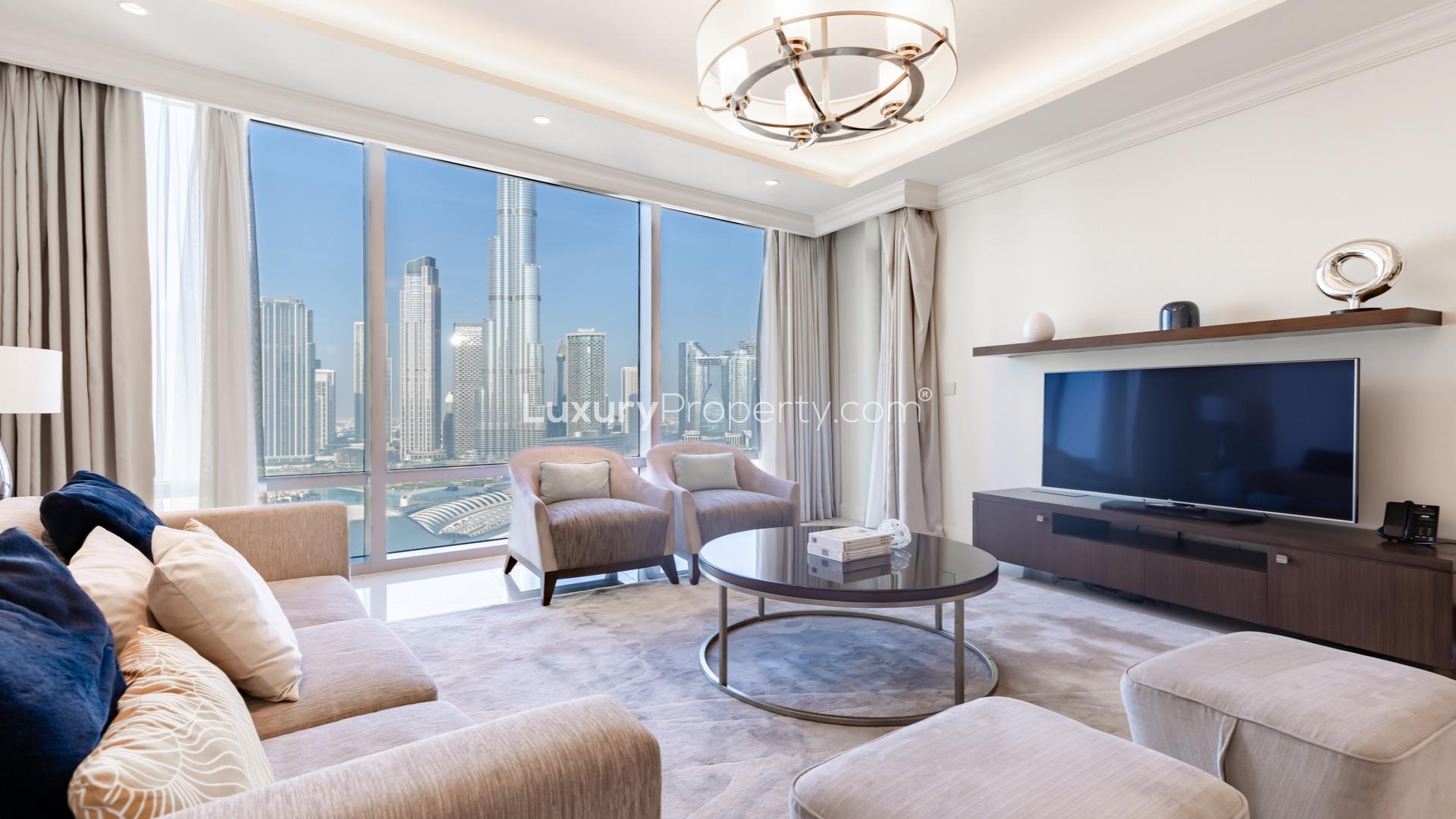 Luxurious living room in Downtown Dubai apartment with city view, modern decor, and ample light