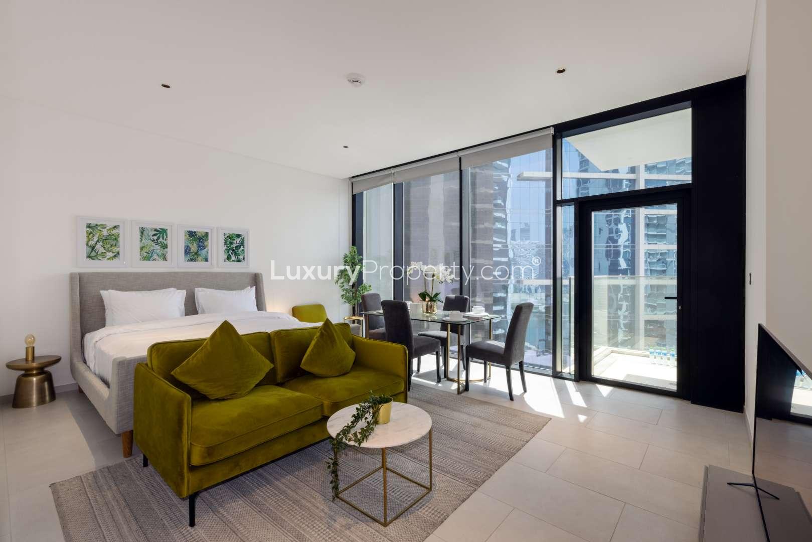 Modern living room and kitchen in Marquise Square apartment, Business Bay, for sale