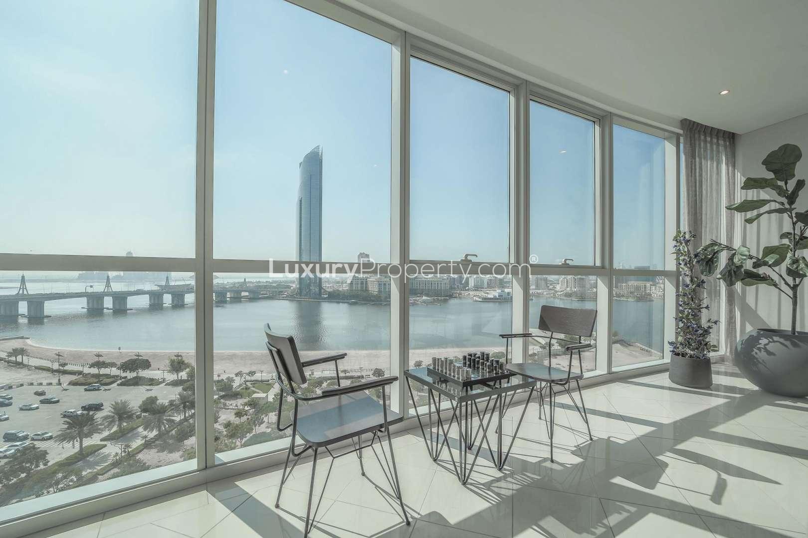 Bright, modern living and dining area in Marsa Plaza, Festival City apartment for sale