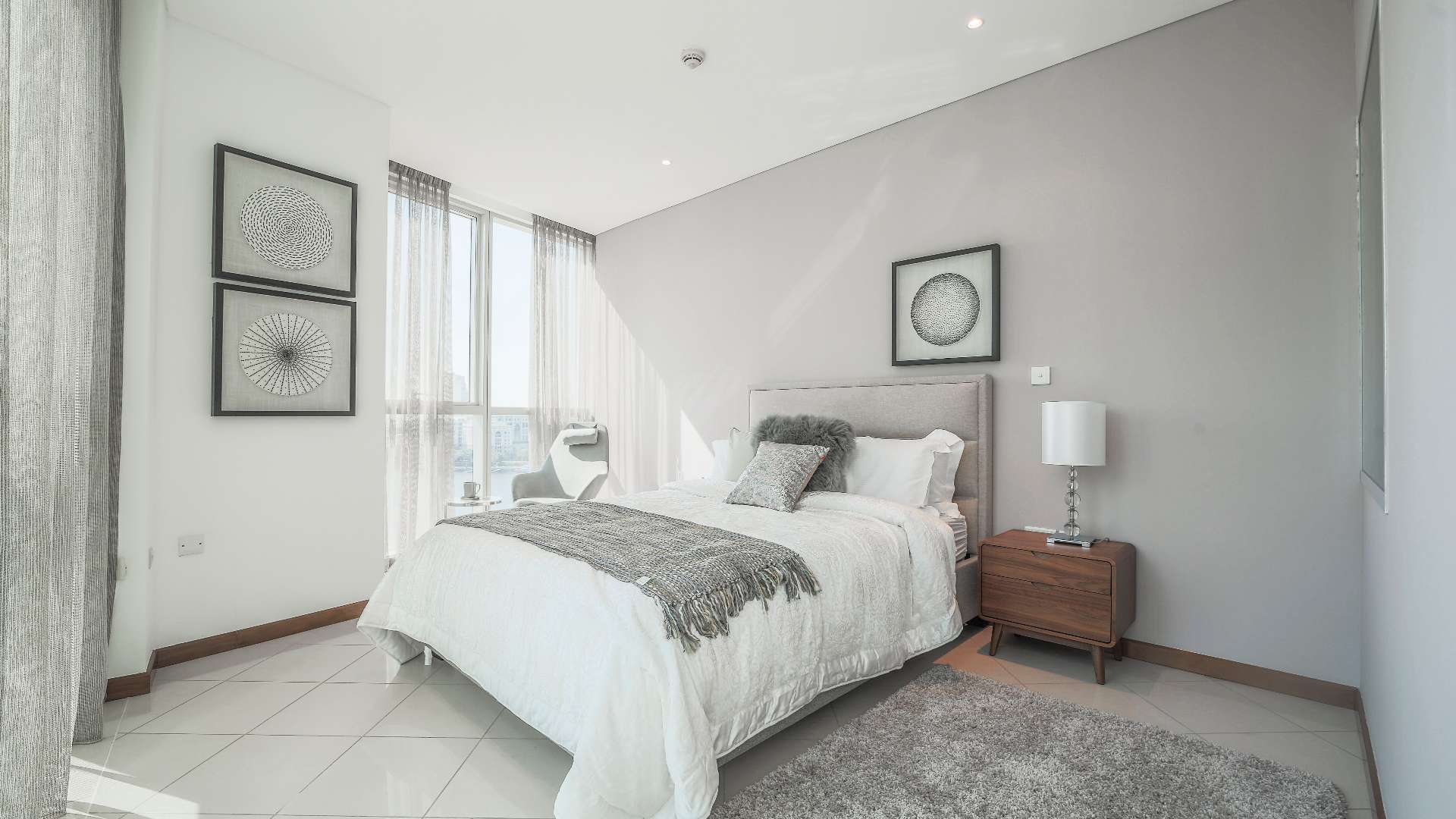 Modern bedroom with large windows in Marsa Plaza, Dubai Festival City apartment for sale