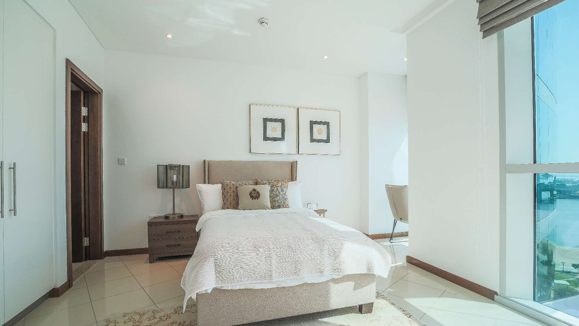 Modern bedroom in two-bedroom apartment, Marsa Plaza, Festival City, Dubai. Bright and elegant decor