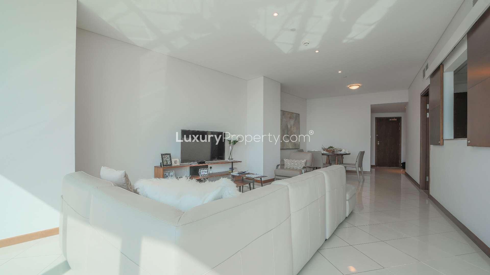 Modern living room and dining area in two-bedroom apartment, Festival City, Dubai