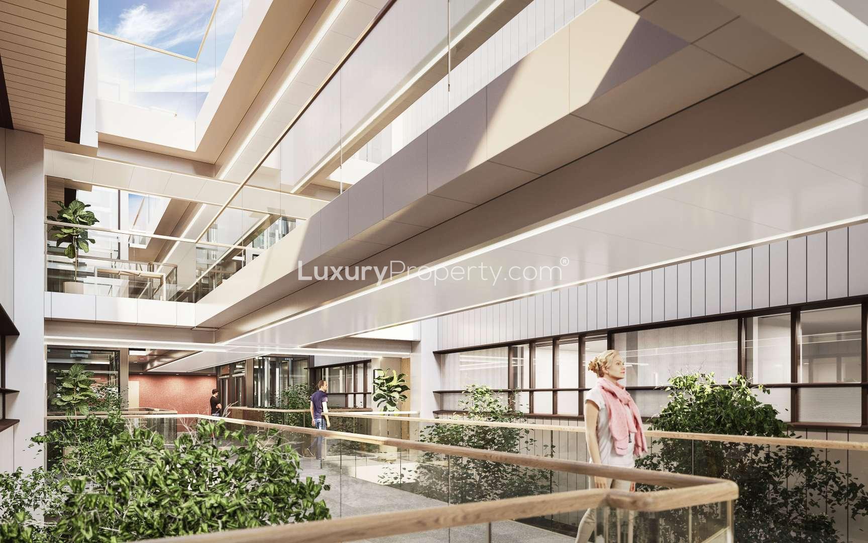 Modern interior walkway in Marylebone Square apartment, featuring greenery and natural light