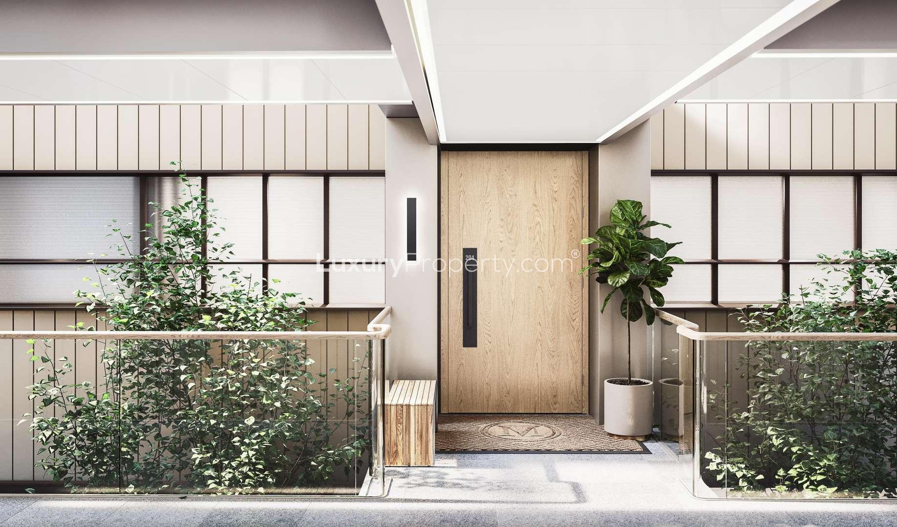 Modern bedroom in Marylebone Square apartment, featuring elegant decor and large windows