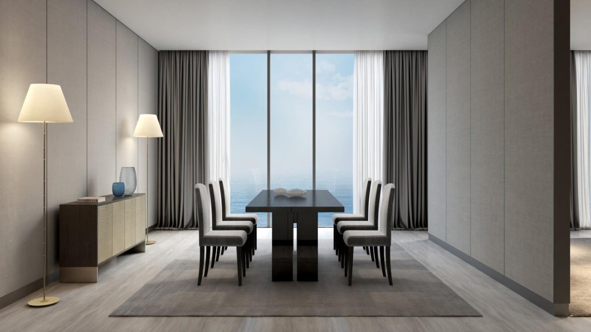 Modern living room in Armani Beach Residences apartment, Palm Jumeirah, with ocean view windows
