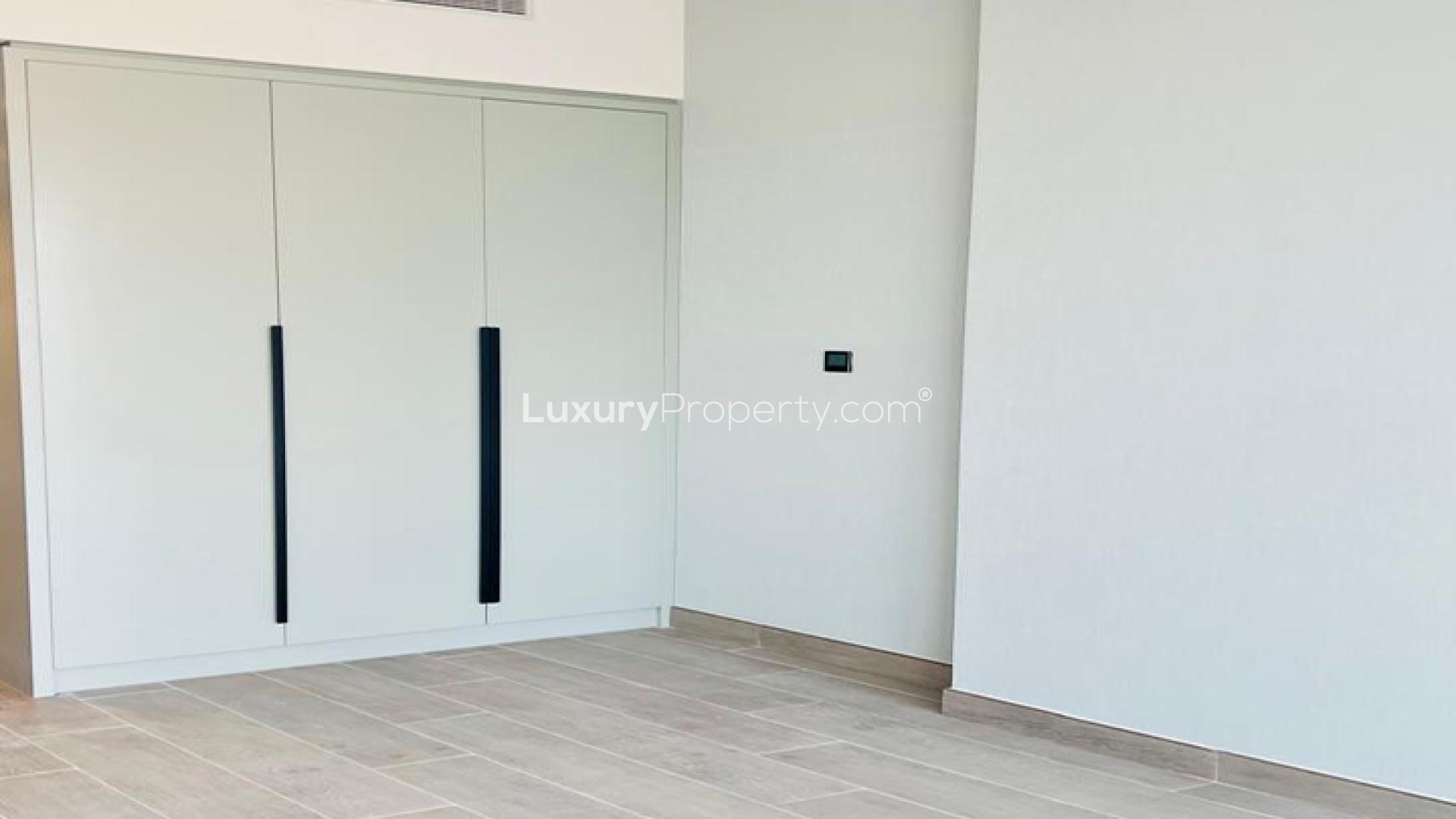 Modern kitchen in 2-bedroom apartment for sale at Golf Gate, DAMAC Hills