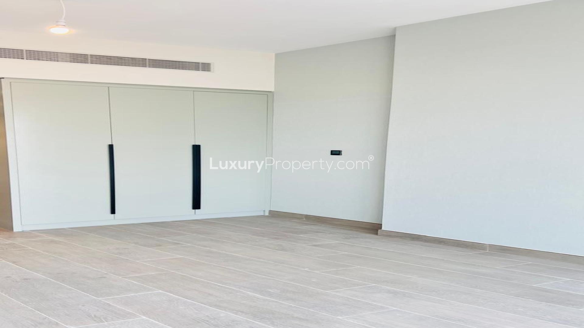 Modern kitchen with large windows in Golf Gate apartment, Damac Hills, for sale