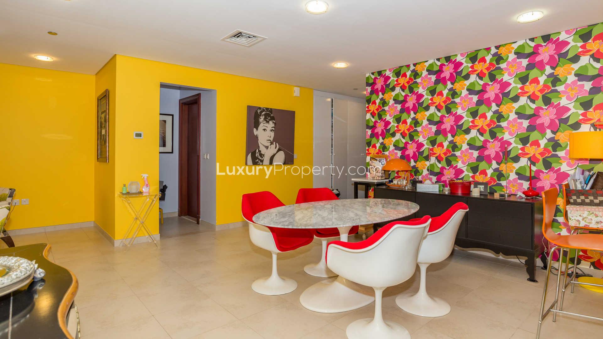 Chic dining area in two-bedroom apartment, Canal Residence, Dubai Sports City. Vibrant decor