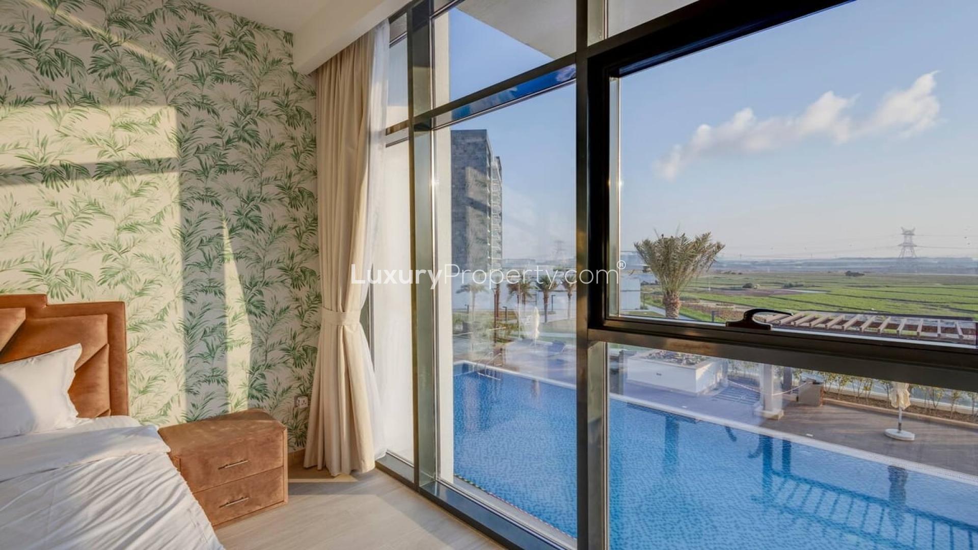 Modern living room in Meydan One apartment, featuring stylish furniture and large windows