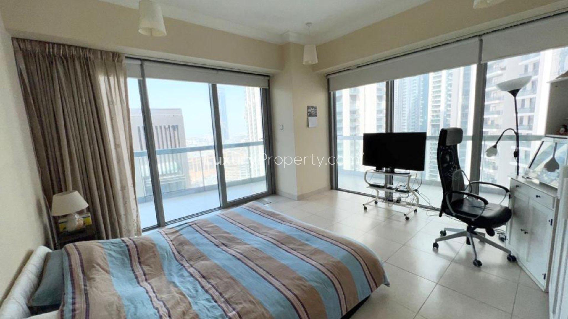 Bedroom with colorful bedding in Downtown Dubai apartment for sale, LP11099