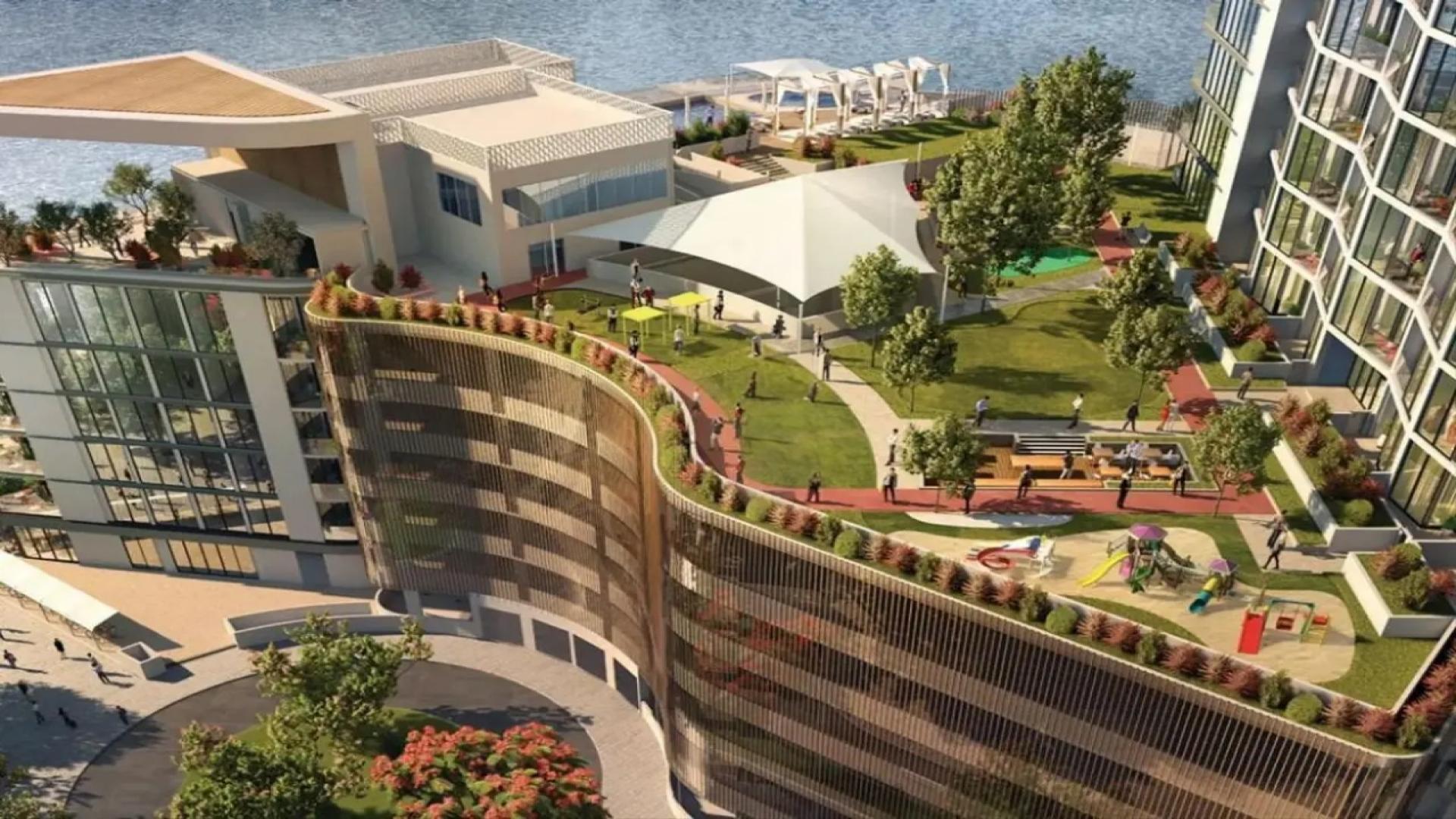 Tall modern apartment buildings in Sobha Hartland, Mohammed Bin Rashid City, Dubai skyline view