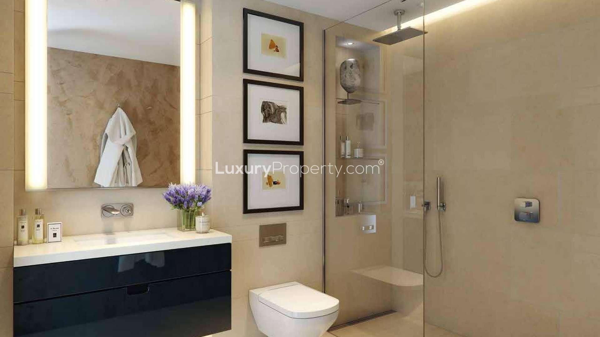 Elegant dining area in two-bedroom Kensington Row apartment, featuring modern decor and lighting