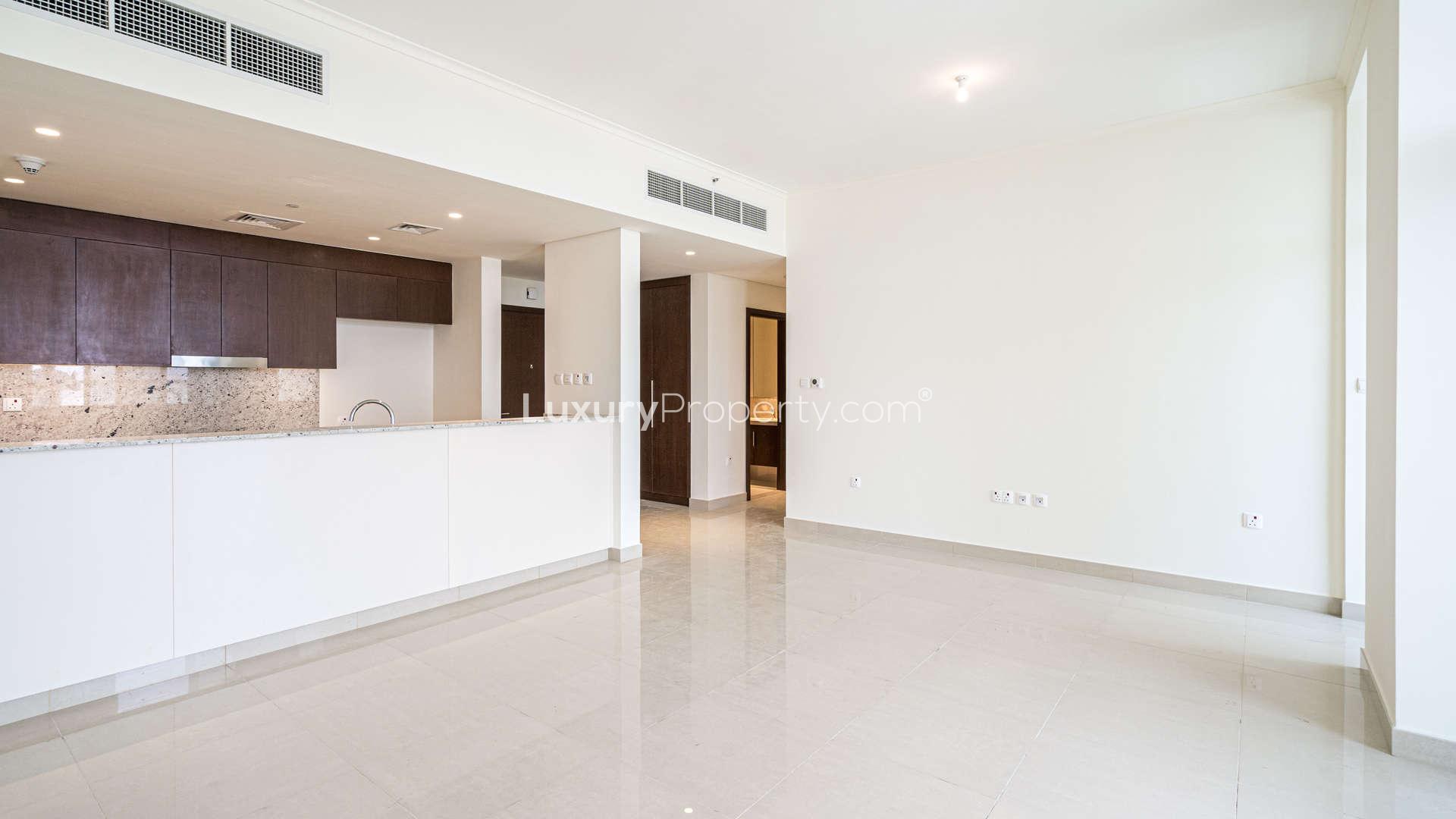 Outdoor pool at Mulberry Park Heights apartment, Dubai Hills Estate, with modern building view