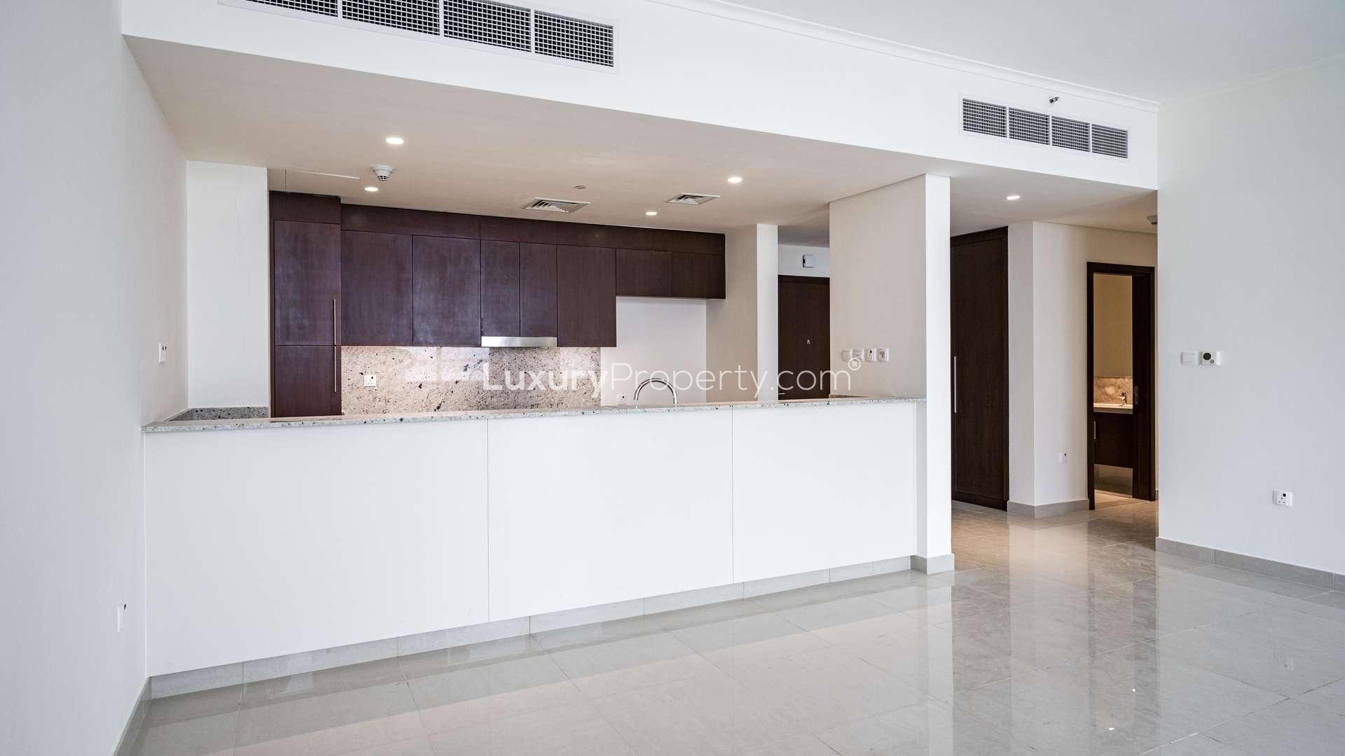 Modern kitchen and living area in Mulberry Park Heights apartment, Dubai Hills Estate