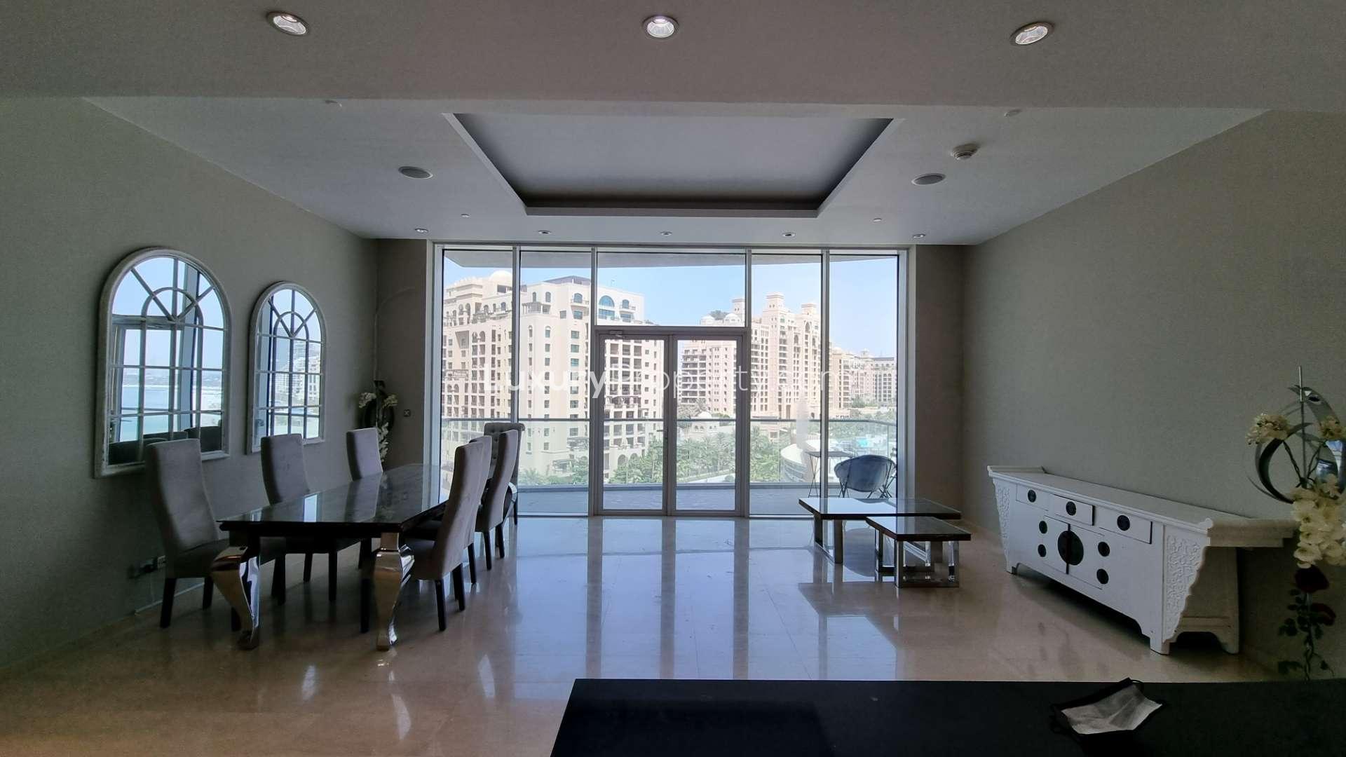 Modern dining area with stunning Palm Jumeirah views in Oceana apartment for sale