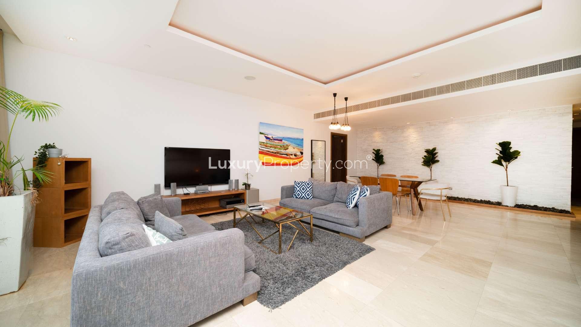 "Spacious balcony with ocean view at Oceana apartment, Palm Jumeirah, private beach access.",Modern living room in Oceana apartment, Palm Jumeirah, featuring stylish furniture and decor