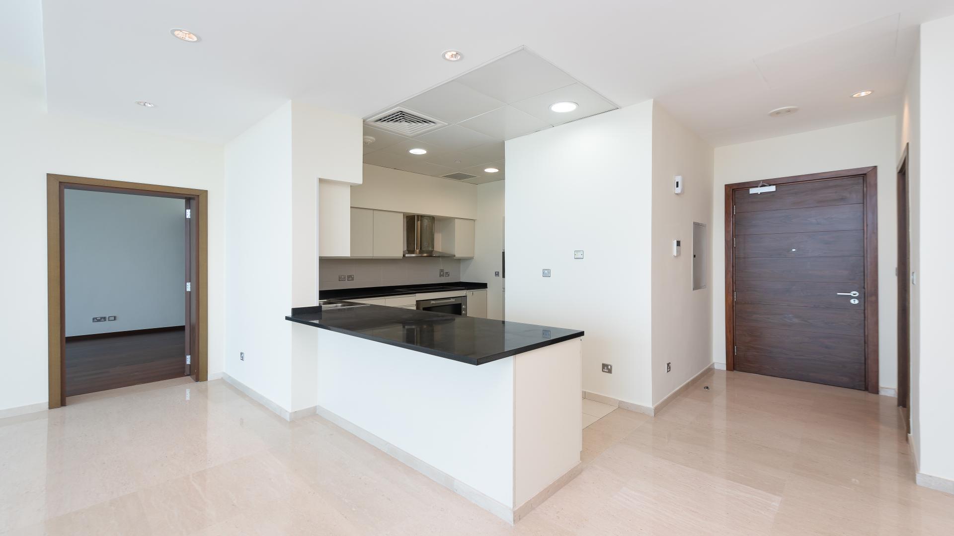 "Balcony view of Palm Marina and Atlantis from Oceana apartment, Palm Jumeirah.",Modern kitchen in 2-bedroom apartment, Palm Jumeirah, Oceana. Spacious layout with sleek finishes