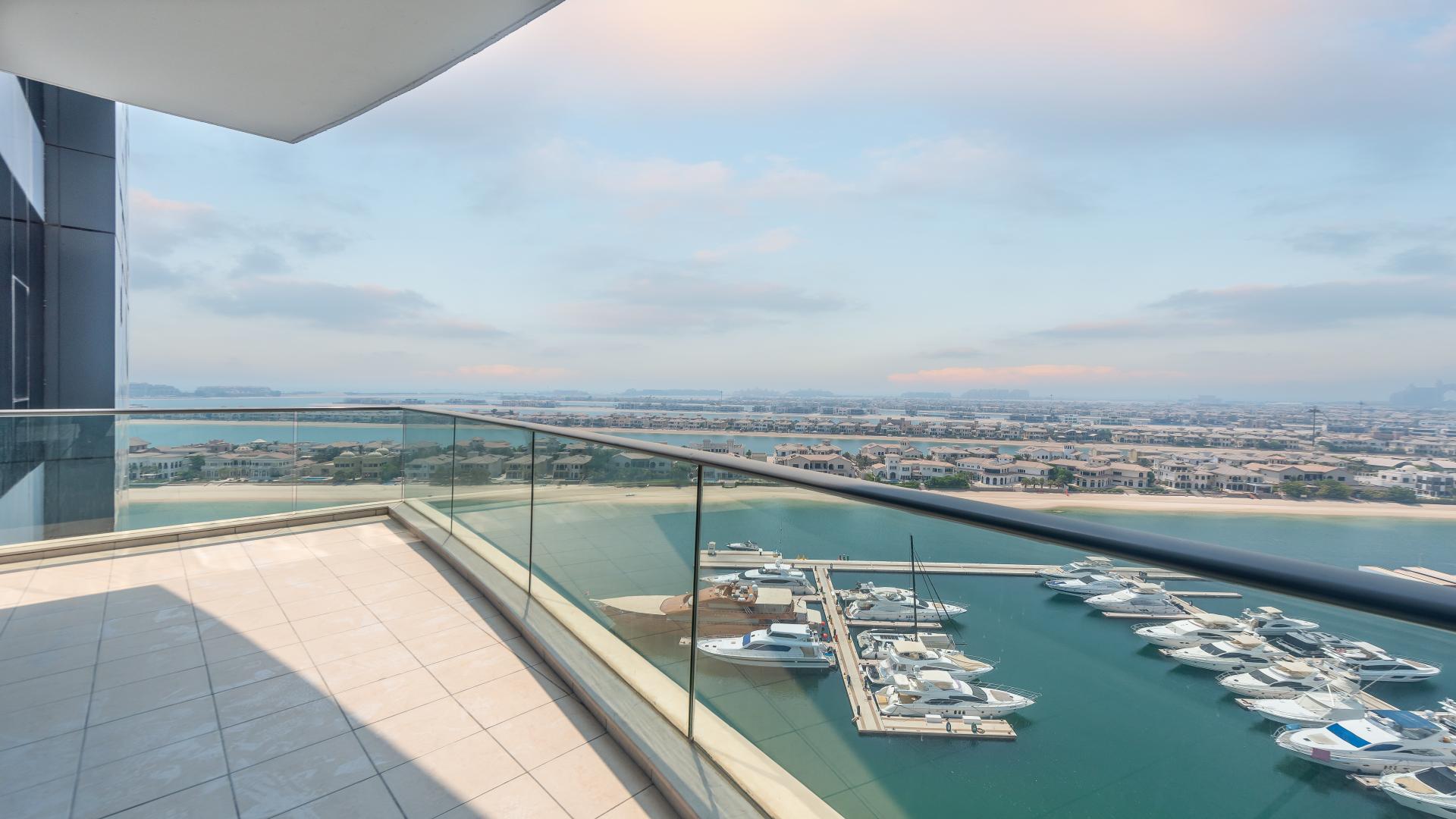 Empty modern apartment interior in Oceana, Palm Jumeirah, with open plan kitchen area