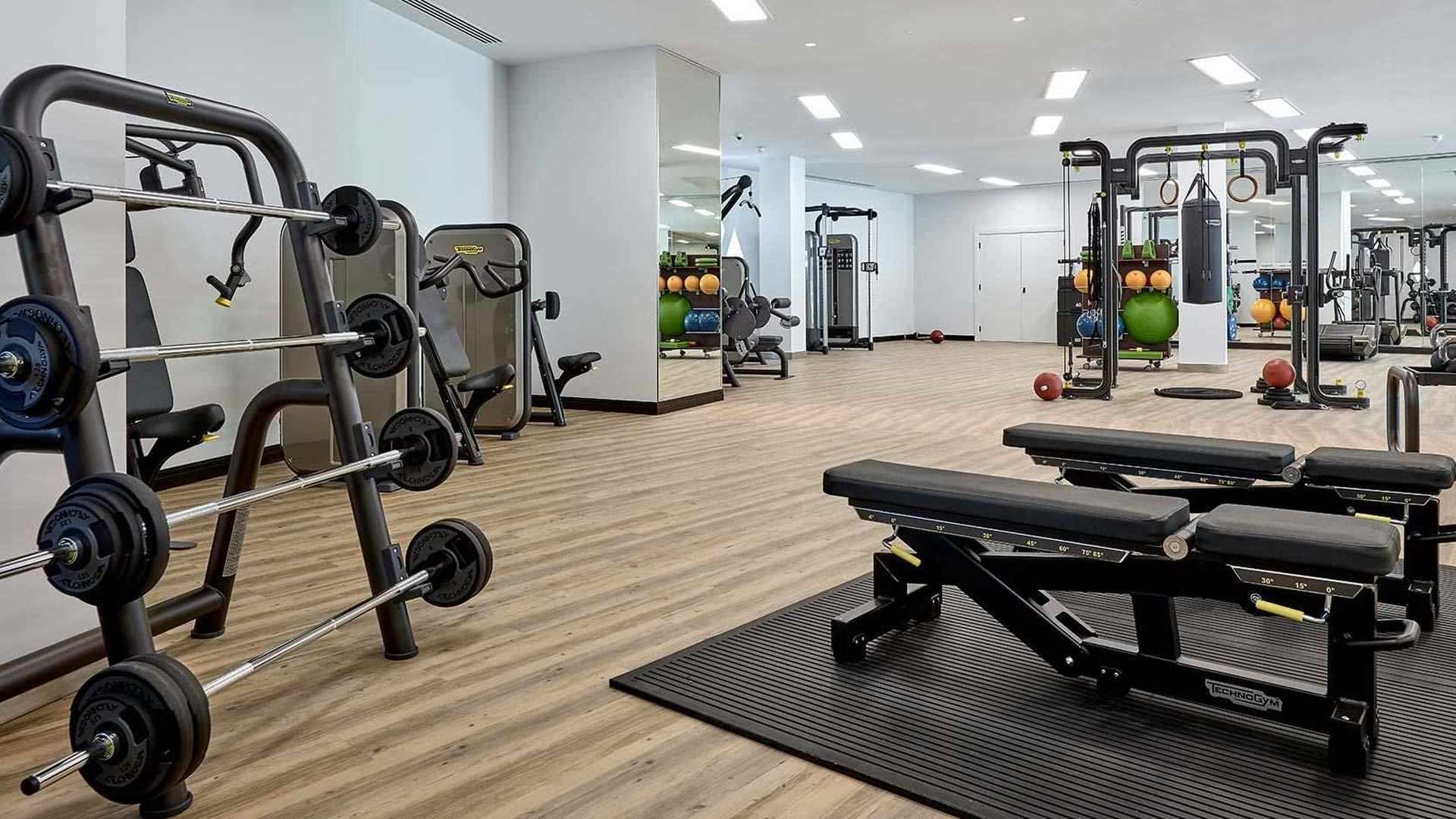 Exterior view of One Blackfriars apartment building with lush trees, South Bank, London