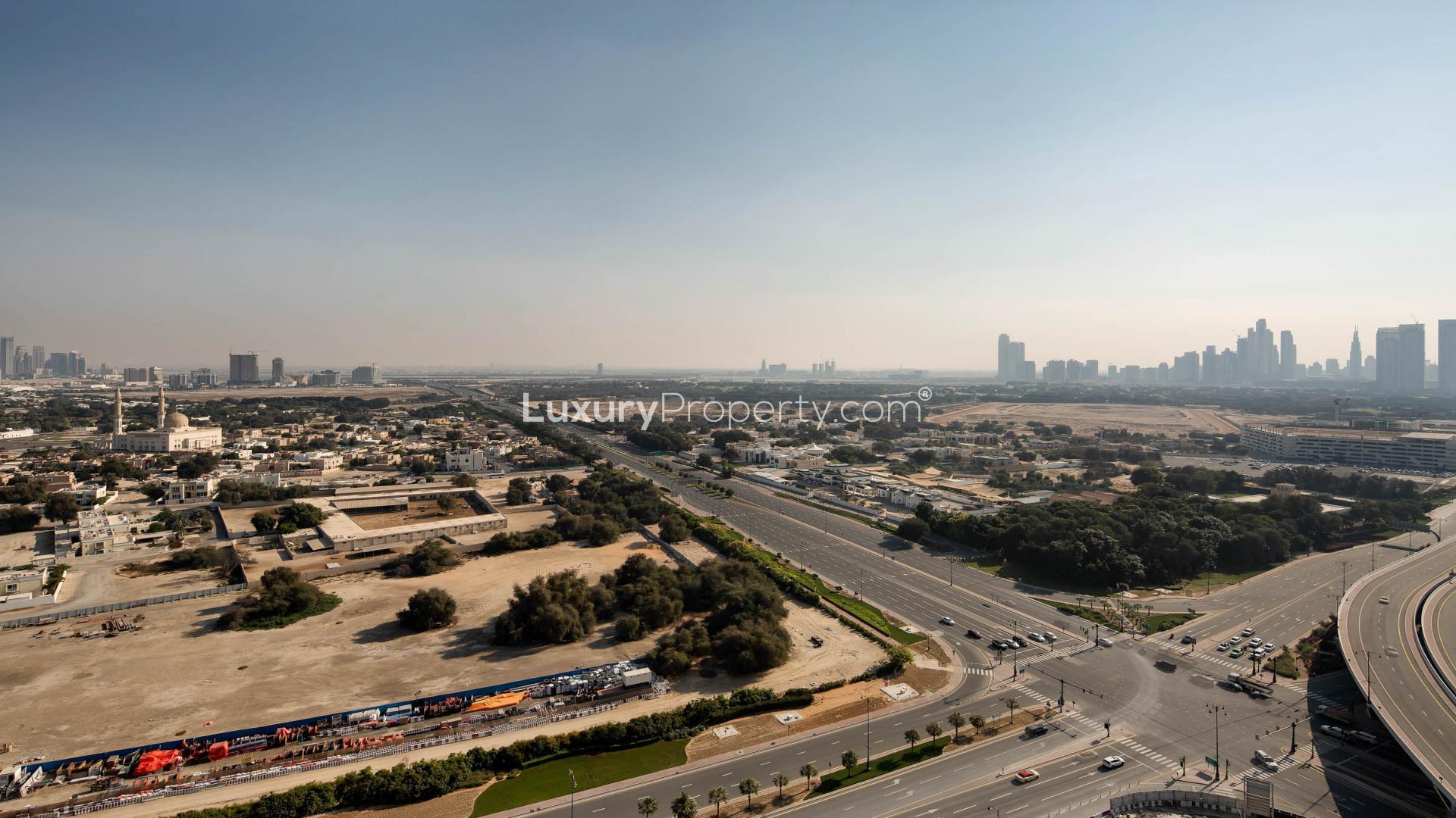 Exterior view of One Za'abeel luxury apartment complex at sunset, Zabeel community