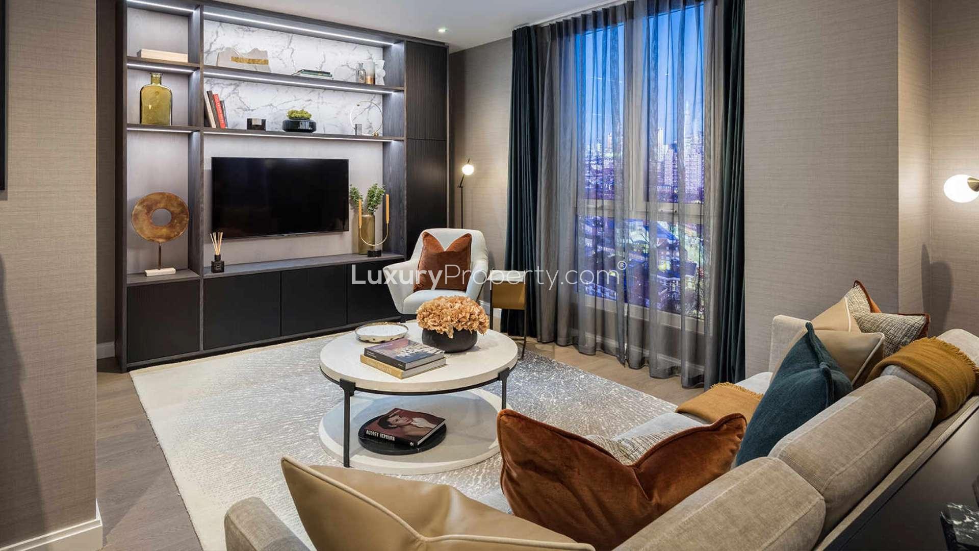 Exterior view of Juniper Gardens apartment in Oval Village, London with city skyline backdrop