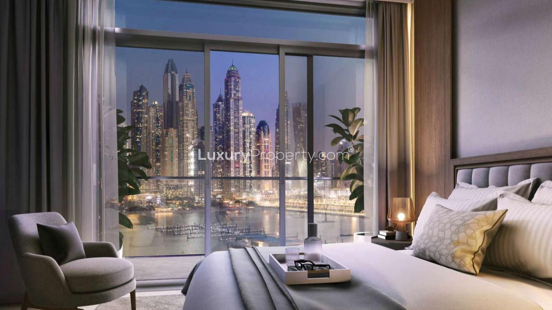 "Luxury Dubai Harbour apartment balcony with stunning city skyline and waterfront views at night.","Luxury Emaar Beachfront apartment bedroom with stunning Dubai Harbour skyline views at night.",Luxury Emaar Beachfront apartment dining room with sea view, Dubai Harbour