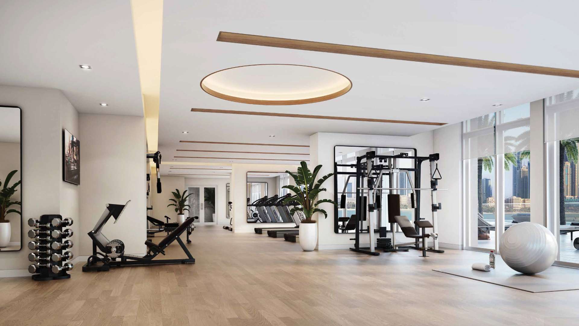 Luxury gym in Emaar Beachfront apartment, Dubai Harbour, with modern equipment and city views