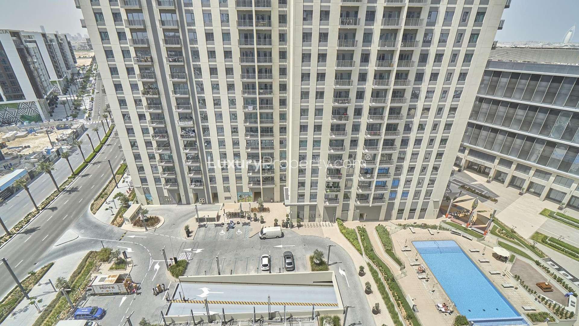 Exterior view of Park Heights 2 apartment building with pool in Dubai Hills Estate