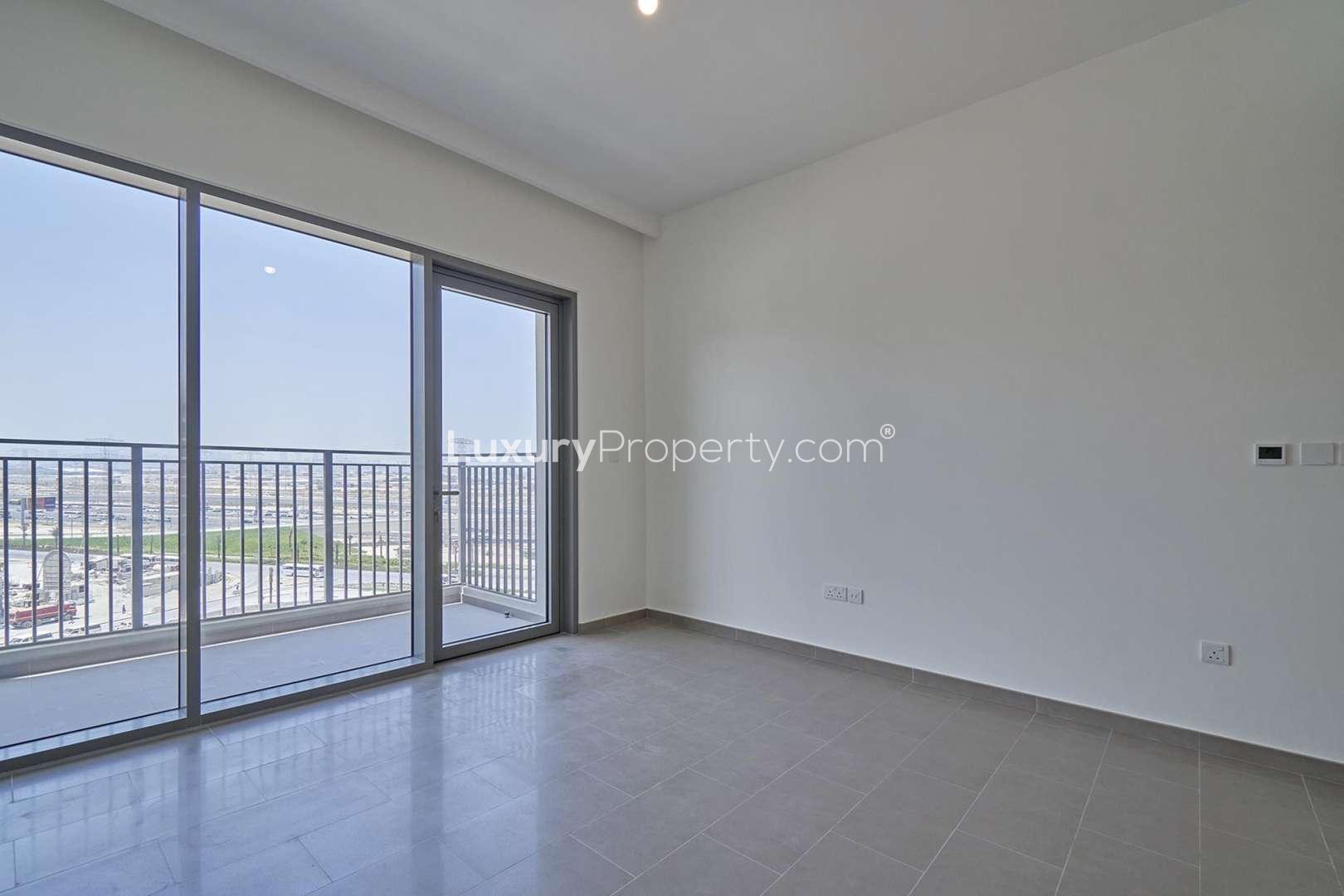 Empty bedroom with window view in Dubai Hills Estate apartment for sale