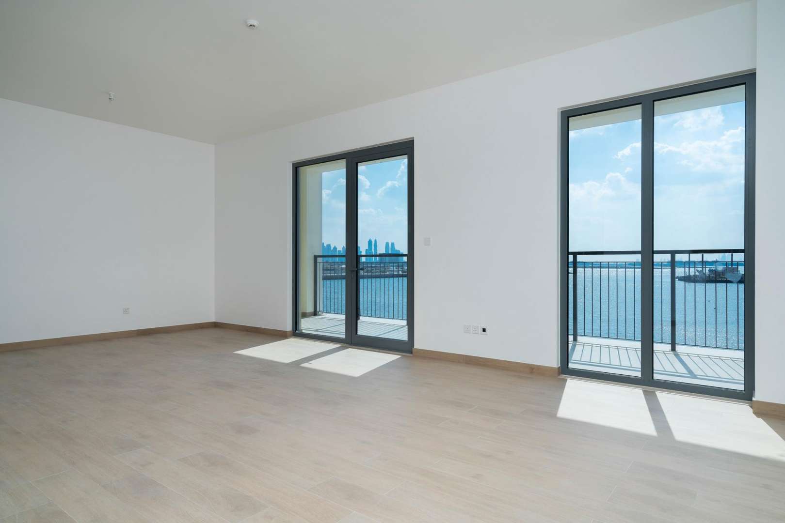 Modern kitchen in two-bedroom apartment at La Cote, Jumeirah, featuring sleek countertops