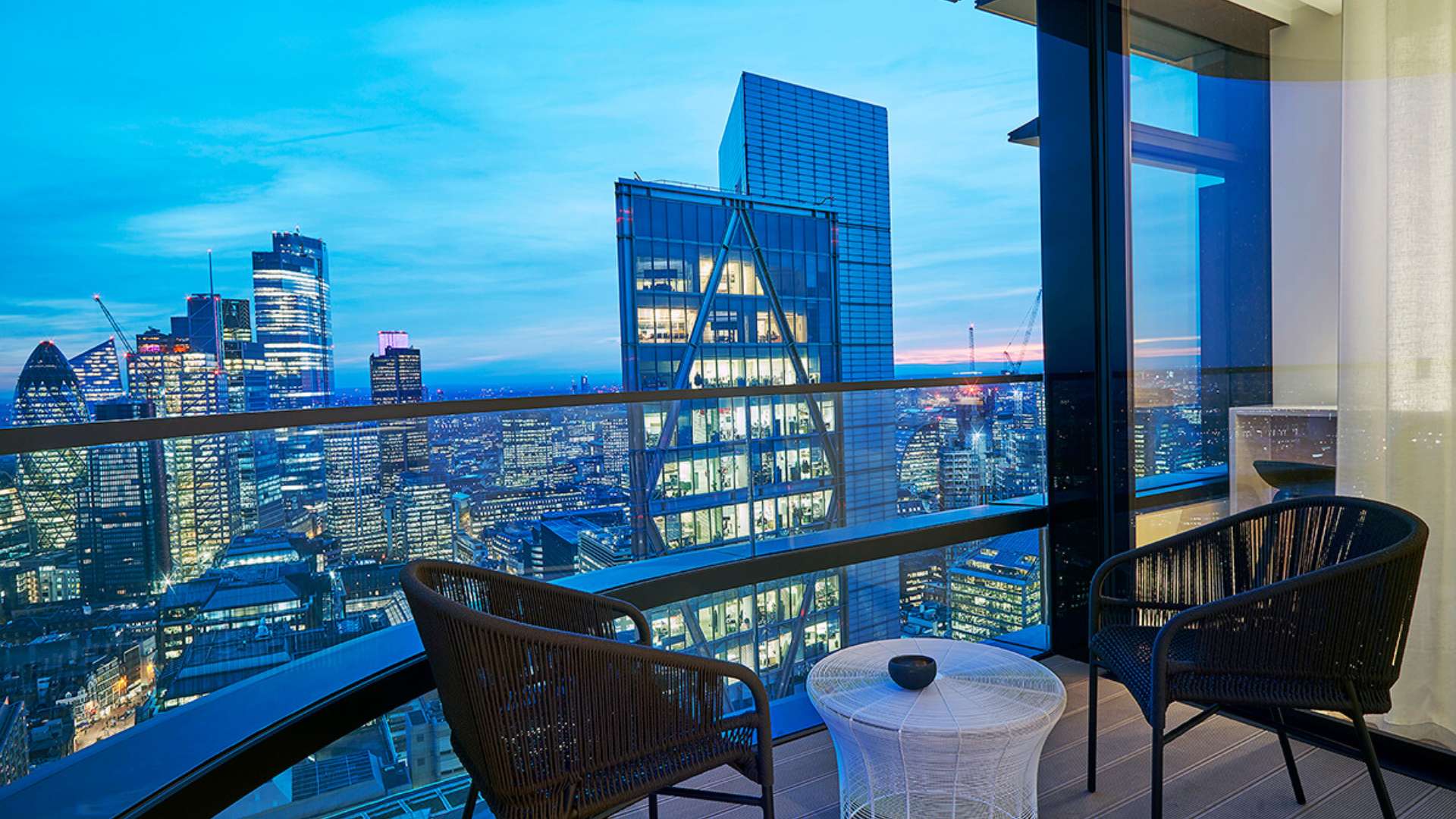 Modern London apartment living area with city views, sleek kitchen in Principal Tower