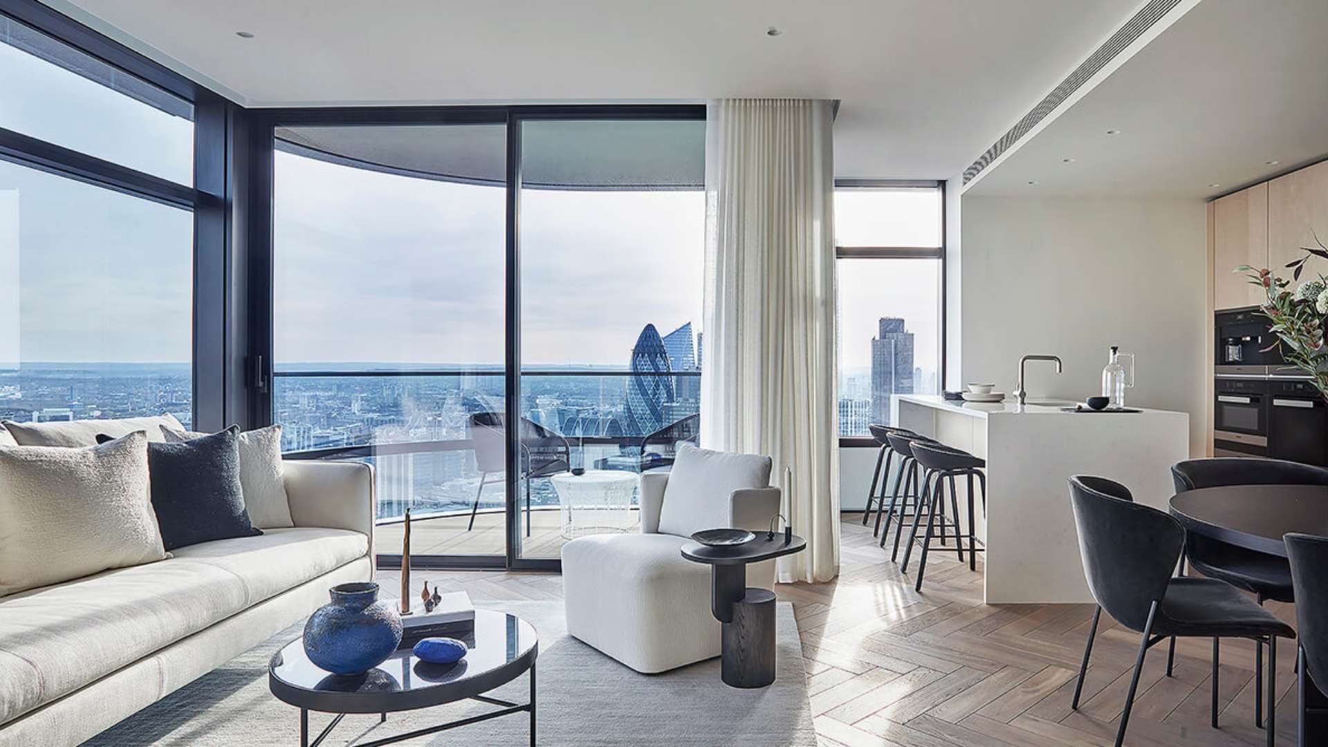 Dining area with city view in Principal Tower apartment, London