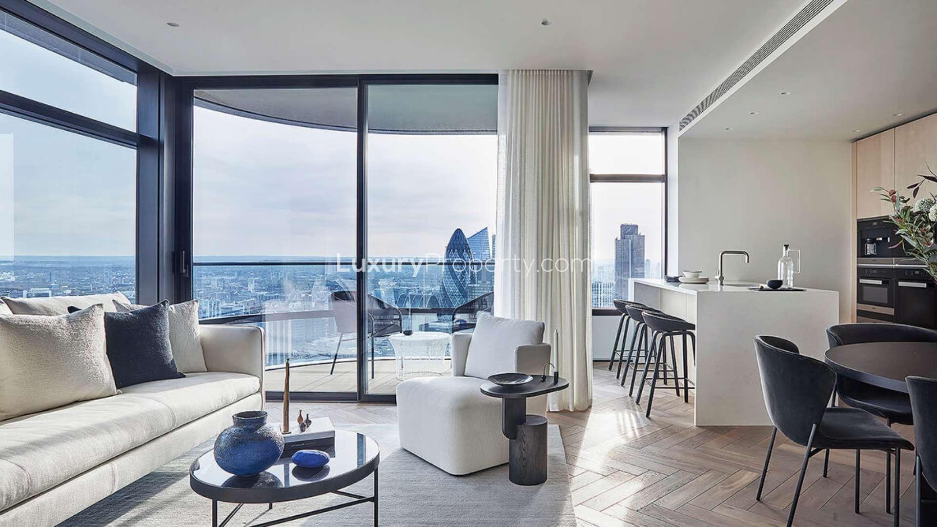 "Penthouse balcony view of London skyline at dusk from Principal Tower apartment.",Modern living area in Principal Tower penthouse, London, with city skyline views