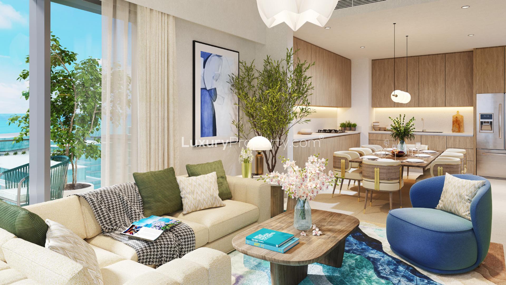 "Modern Mina Rashid apartment with pool, palm trees, and luxurious amenities for sale.",Modern living room and kitchen in Seascape Mina Rashid apartment with ocean view balcony