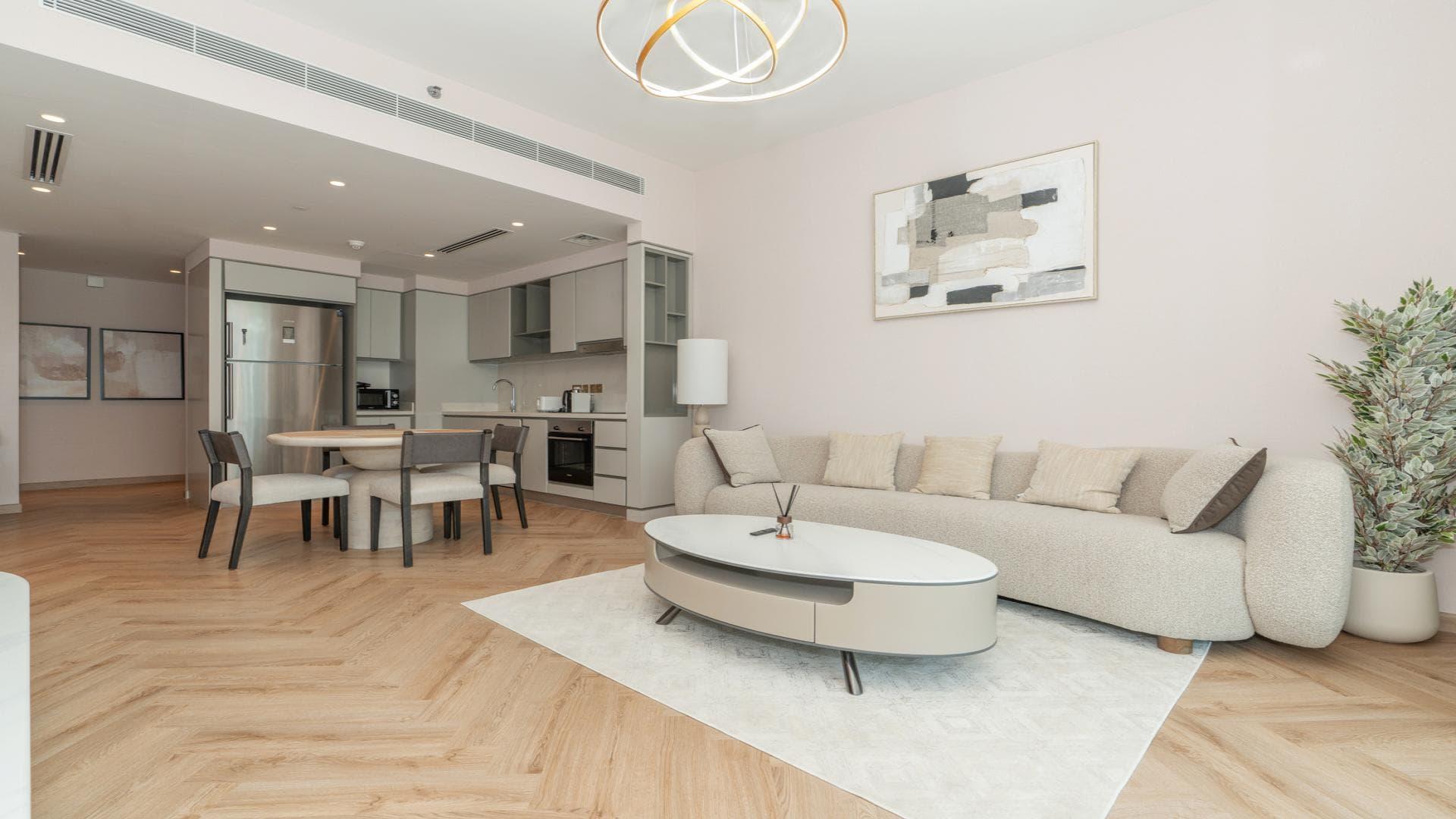 "Modern living room in spacious two-bedroom apartment, Emaar Beachfront, Dubai Harbour, LP46849.",Modern living room in Dubai Harbour apartment, featuring elegant decor and cozy seating area