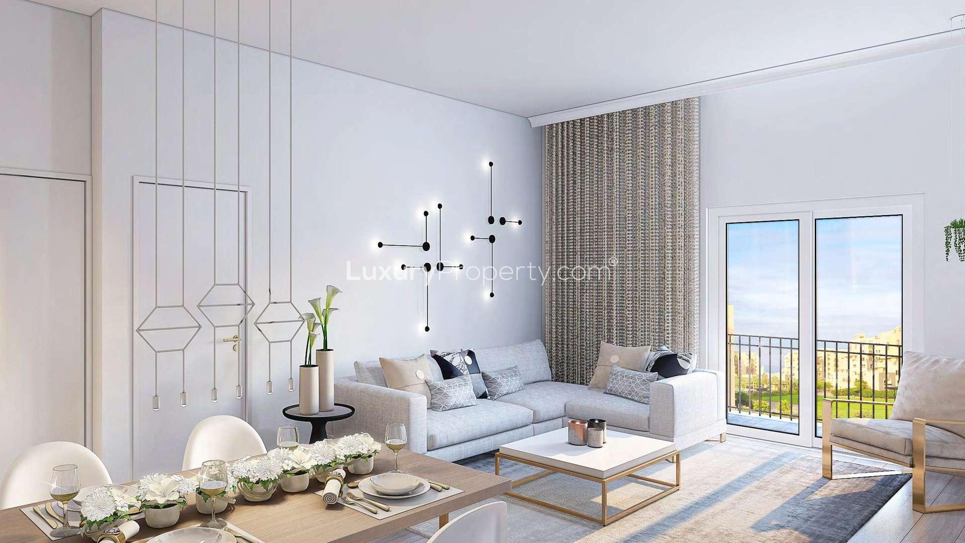 Contemporary living room with modern decor in Remraam, Dubailand two-bedroom apartment for sale