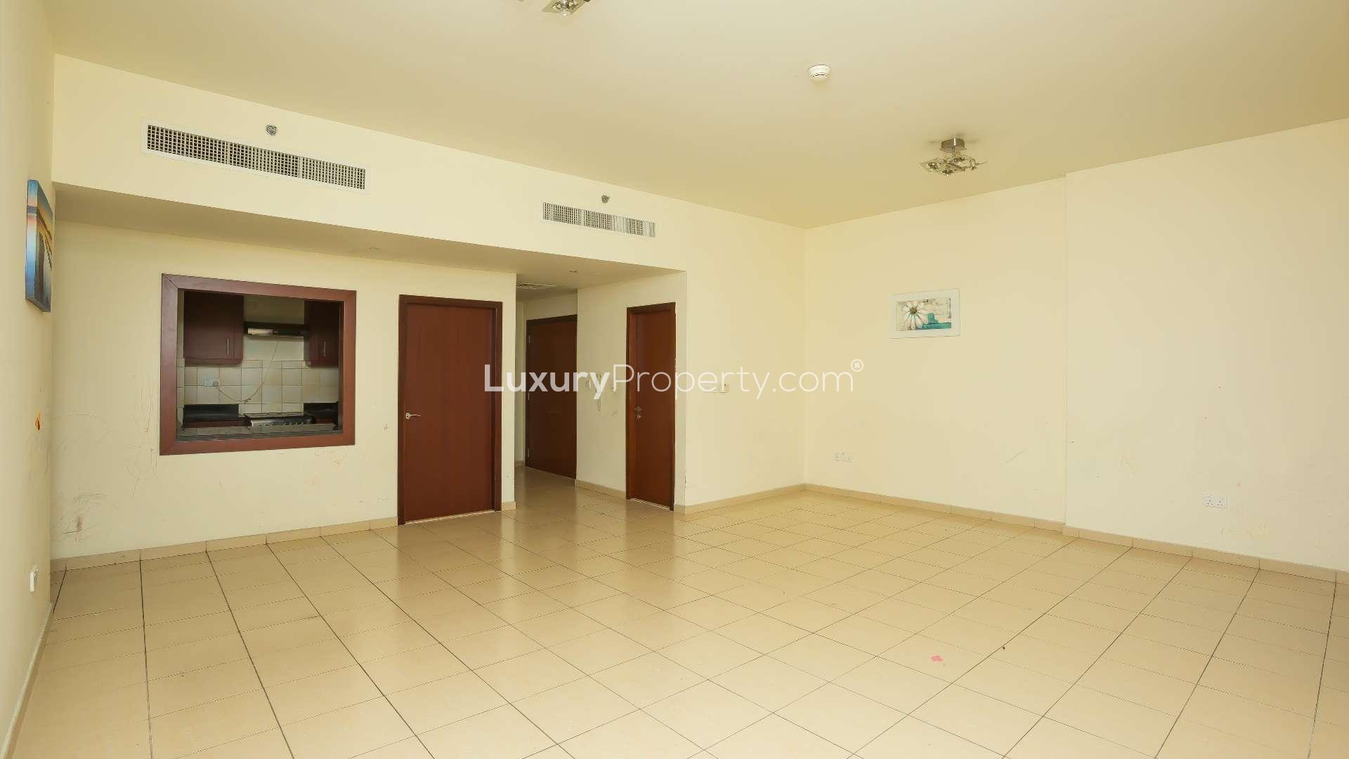 Empty bedroom with wooden closet in Rimal 1 apartment, Jumeirah Beach Residence