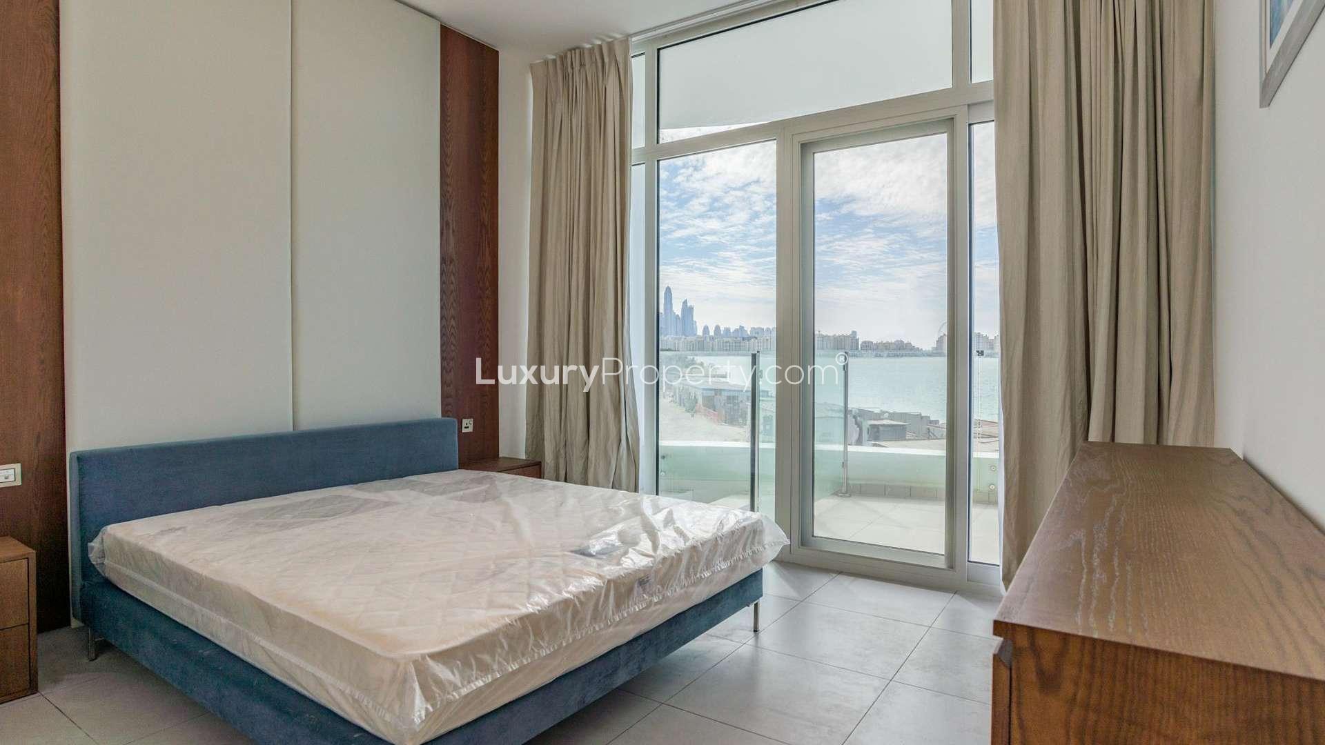 "Beachfront pool view from stylish 2-bed apartment in Royal Bay, Palm Jumeirah for sale.",Stylish bedroom with sea view in Royal Bay, Palm Jumeirah apartment for sale