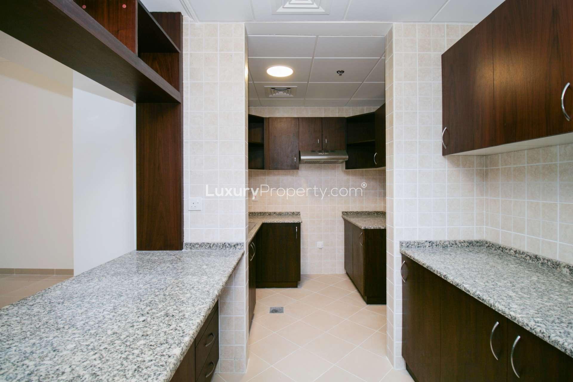 Empty living room with tiled floor in Sarai Apartments, Palm Jumeirah, spacious and modern design