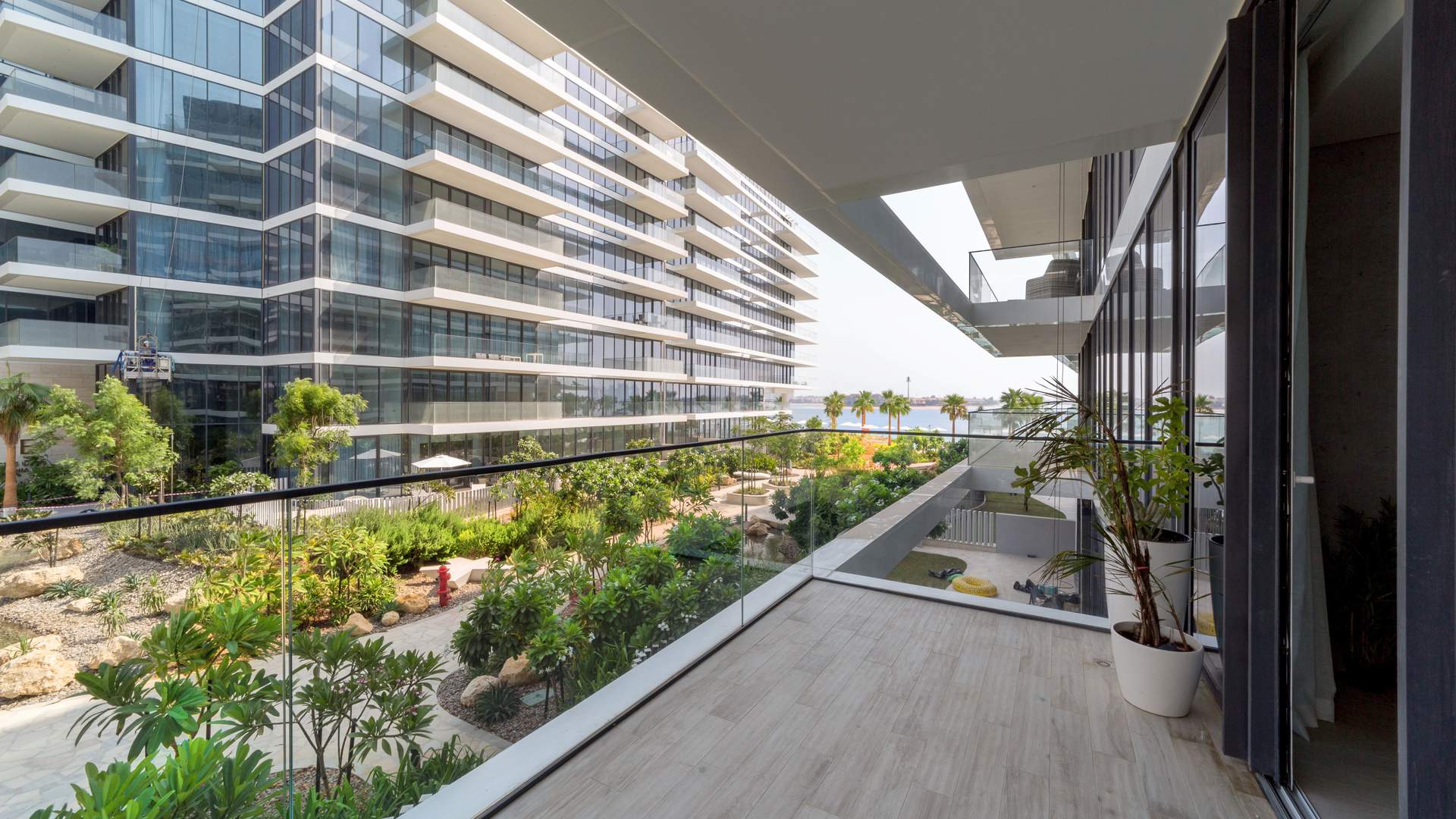 Balcony view of lush gardens at Serenia Residences, Palm Jumeirah apartment for sale