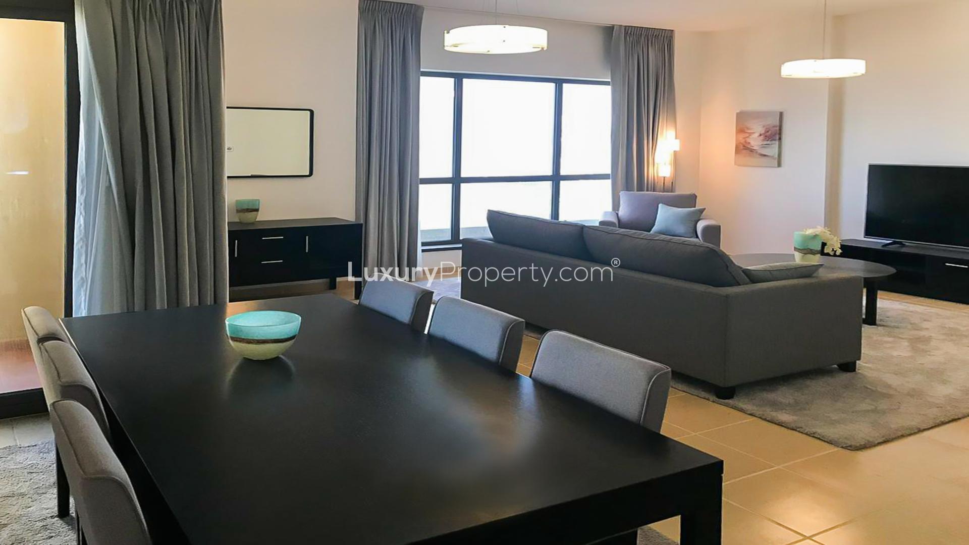Modern living room in semi-upgraded JBR apartment, Shams, featuring comfortable seating and decor
