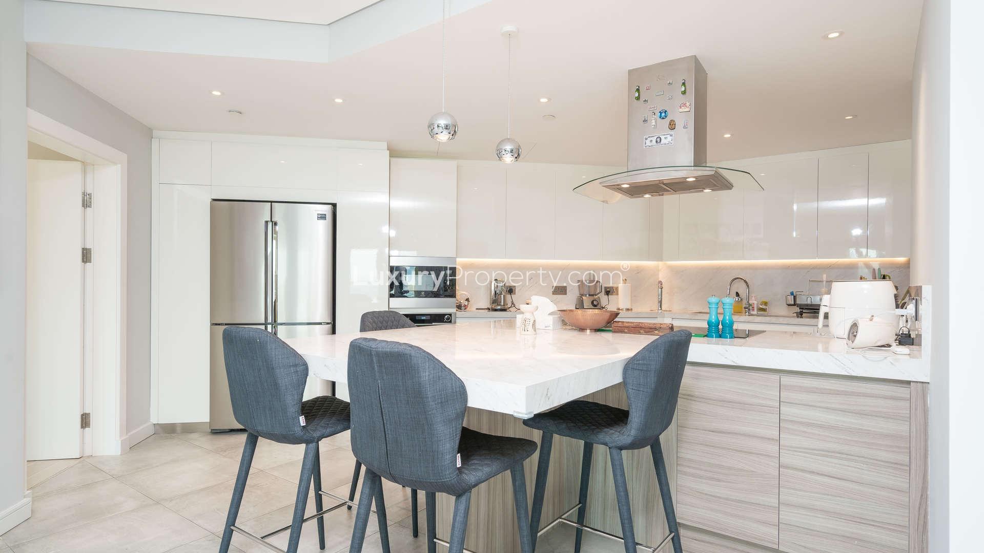 Modern kitchen and dining area in fully upgraded 2-bedroom apartment, Shoreline Residences, Palm Jumeirah